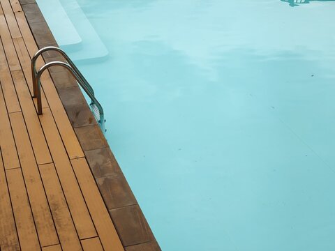 Poolside Ladder and Steps in Turquoise Water