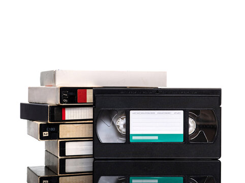 Stack of vintage VHS cassette tapes isolated on white back