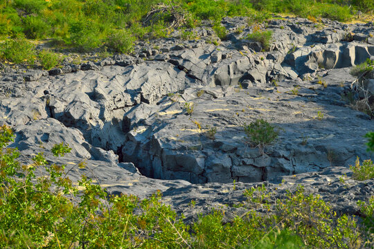 forre laviche del Simeto: ancient basalt where flowing Simeto River, Adrano, Sicily, Italy 
