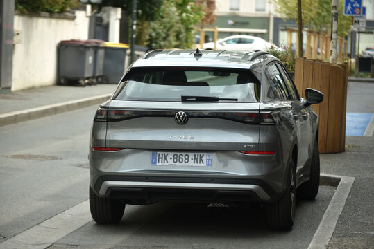 St - Amand Montrond - France - 3 august 2026 - Rear view of a grey Volkswagen T Roc eTSI parked on a street, showing a modern compact SUV in an urban environment.
