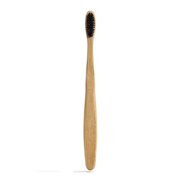 Natural bamboo toothbrush with black bristles on transparent background