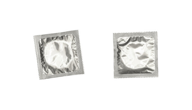 Silver foil wrapped condom isolated PNG on transparent background, contraceptive protection for safe sex and sexual health