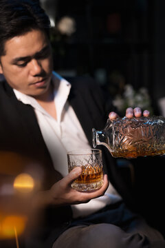   
Closeup businessmen holding a glass of whiskey