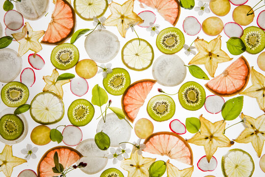Citrus fruit, kiwi, variety fruits  segments on a white background, top view