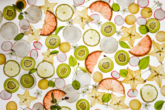 Citrus fruit, kiwi, variety fruits  segments on a white background, top view