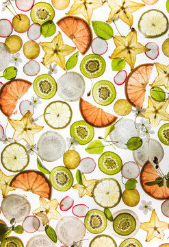 Citrus fruit, kiwi, variety fruits  segments on a white background, top view