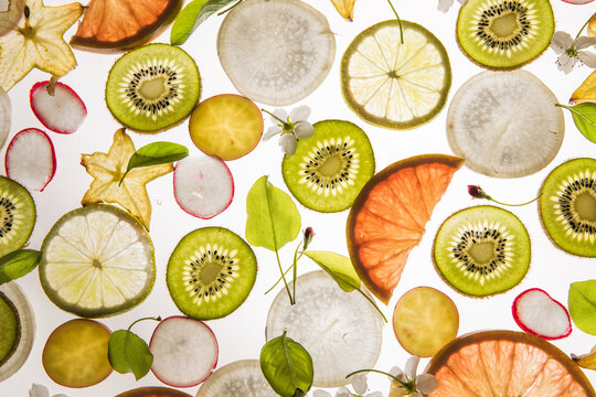 Citrus fruit, kiwi, variety fruits  segments on a white background, top view