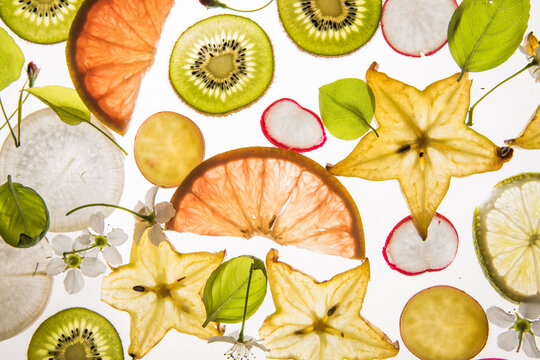 Citrus fruit, kiwi, variety fruits  segments on a white background, top view