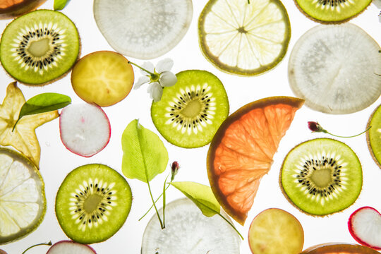 Citrus fruit, kiwi, variety fruits  segments on a white background, top view