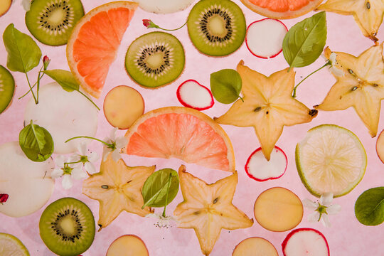Citrus fruit, kiwi, variety fruits  segments on a white background, top view