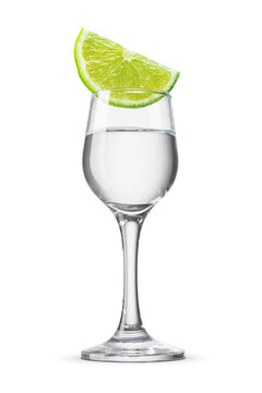 Vodka or clear hard liquor alcoholic beverage shot glass with lime wedge isolated. Transparent PNG image.