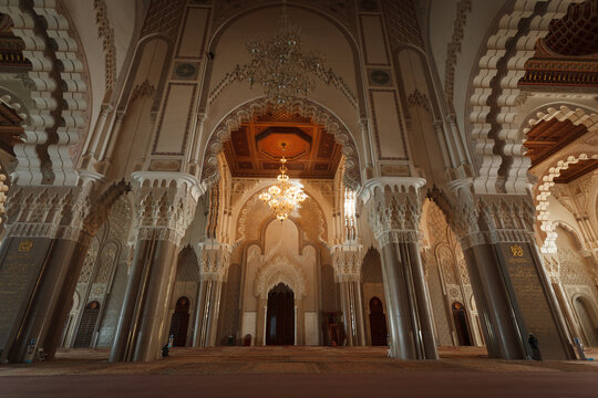 Illuminated grand hall entrance in interior of the historic mosque in Casablanca, Morocco
