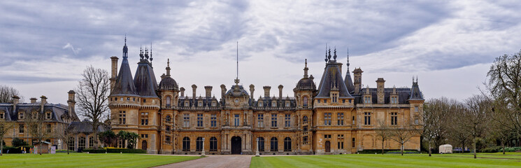 Fototapeta premium Grand Neo-Renaissance facade of Waddesdon Manor under a cloudy sky in Buckinghamshire