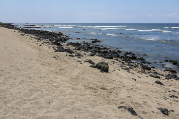 Panoramic view of a rocky coastline with sand and volcanic lava rocks on the Big Island Hawaii © Joao Vieira