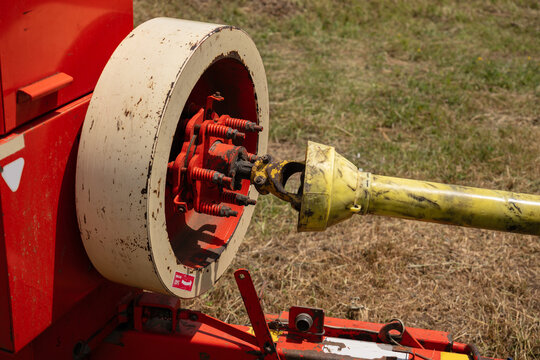 Power take-off shaft connecting farming machinery outdoors