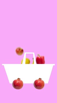 Playful grocery cart with pomegranate wheels filling with fresh produce in vertical animation. Concept of creative food advertising, healthy shopping motivation, playful supermarket branding.