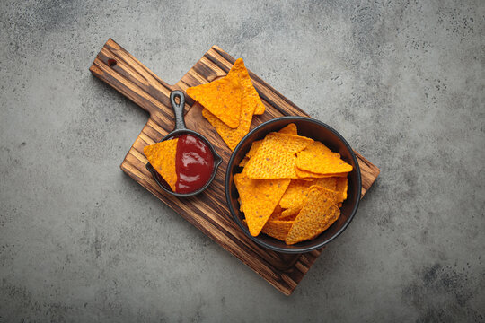 Nachos tortilla chips salsa dip wooden board Mexican Tex-Mex snack fast food