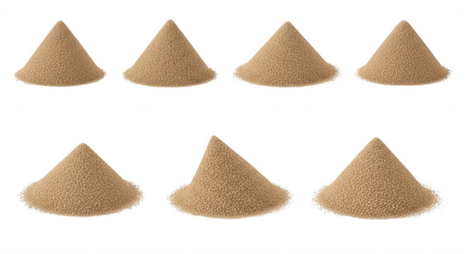 isolated piles of brown granular substance on a white surface possibly for use in construction or art with light shadow reflections
