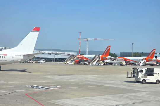 Basel, Switzerland, May 25, 2026: Busy with Commercial Aircraft and Passenger Boarding at European Hub