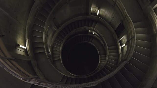 Concrete Spiral Stairs to Underground: Cinematic Zoom Out from Center