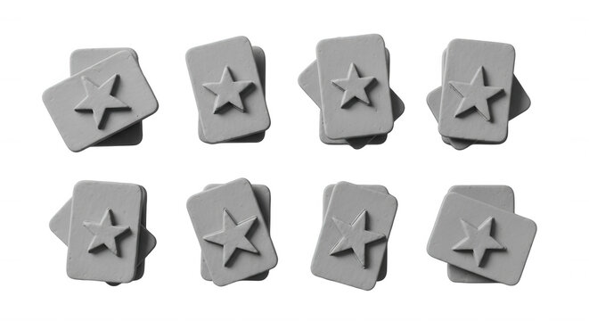 gray star shaped playing card stacks arranged on a white surface games or design