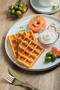 Crunchy waffle fries with sour cream dip served in a basket