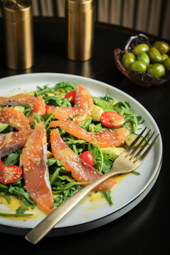 Salad with salted salmon and arugula