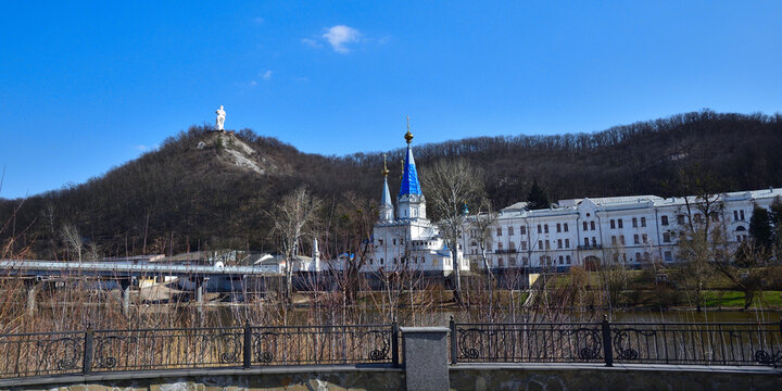 View of the Svyatogorsk Lavra and the monument to Artem on a sunny spring day.