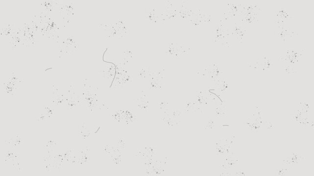 Vintage film damage effect background with static grain and scratch marks on light gray surface for nostalgic cinematic projects.
