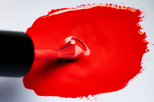 bright red nail polish close up