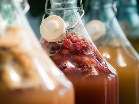 Different Flavors of Homemade Drinks in Glass Bottles