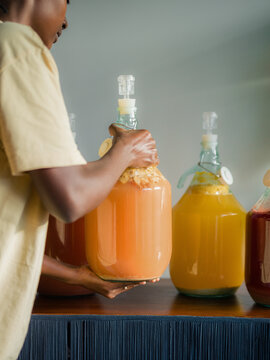 Woman making homemade alcoholic beverages 