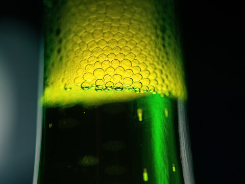 Macro of beer bottle with bubbles 