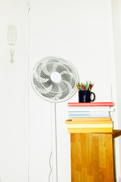 Fan/ventilator  in business office during summer heat waves with flash