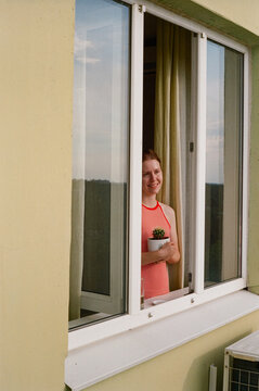 Young woman in her city apartment

