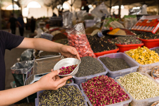 Vendor Selling Spices, Tea and Dried Fruits in Bazaar