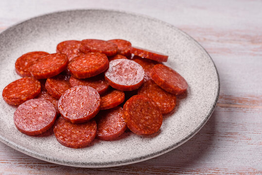 Slices of smoked pepperoni or salami for making homemade pizza. Sliced pepperoni