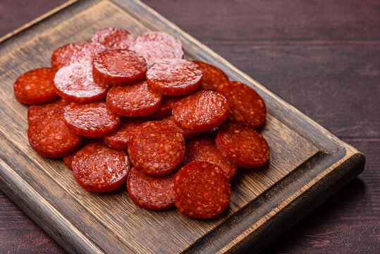 Slices of smoked pepperoni or salami for making homemade pizza. Sliced pepperoni