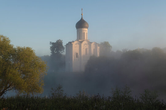 Morning misty landscape with the medieval Church of the Intercession on the Nerl. Bogolyubovo, Vladimir region. Russia