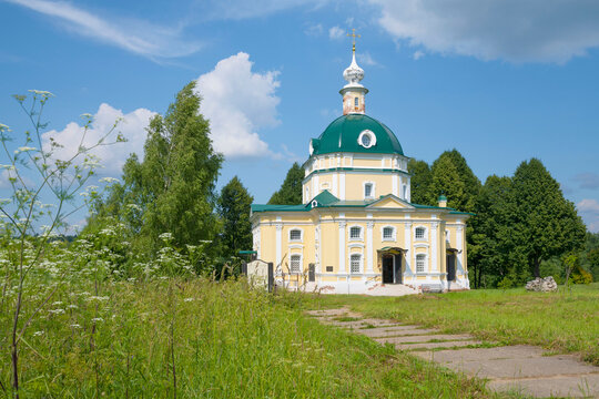 The ancient church of St. Michael the Archangel in a summer landscape on a sunny July day. Tarakanovo manor, Moscow region