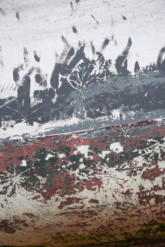 Detail of weathered paint on a rowing boat