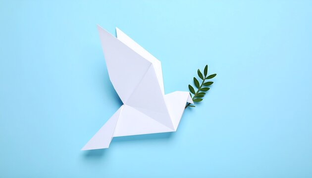 Paper origami dove carrying an olive branch representing peace