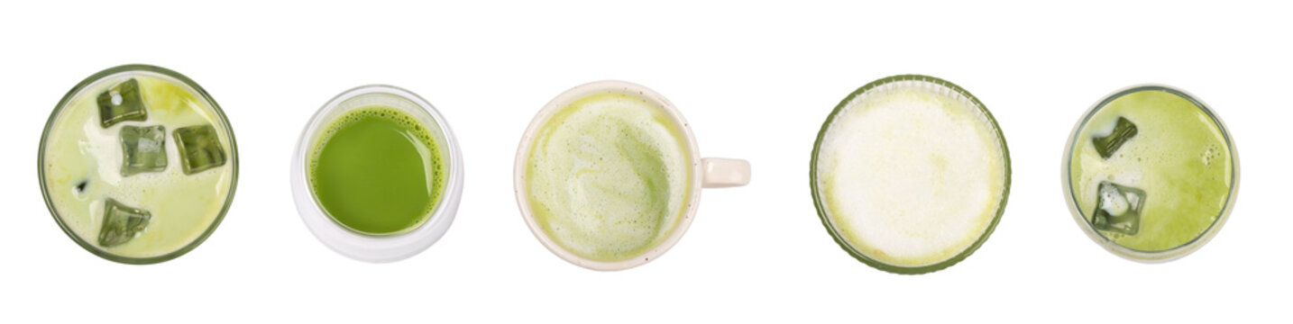 Fresh matcha latte in clear glass isolated on white background with whisk and matcha powder. Iced matcha latte. Japanese green tea drink, creamy milk beverage, healthy antioxidant breakfast. 