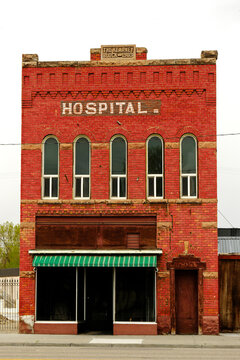 Old Hospital Brick Building Downtown in a Small City Antiquated and Abandoned