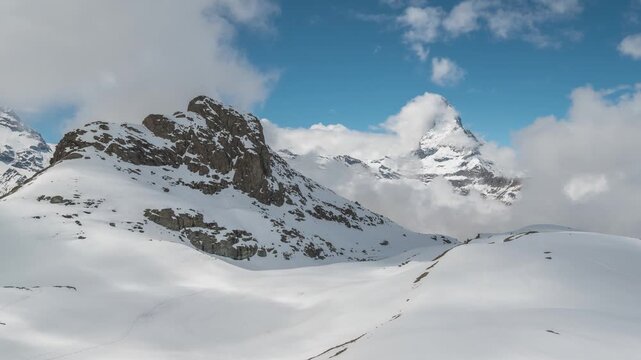 Zermatt Switzerland time lapse at Matterhorn mountain peak and Riffelsee lake in winter season