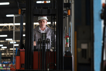 Warehouse, deposit or storage concept. Warehouse worker at work, organizes, and moves stock inside a storage or fulfillment center © amorn