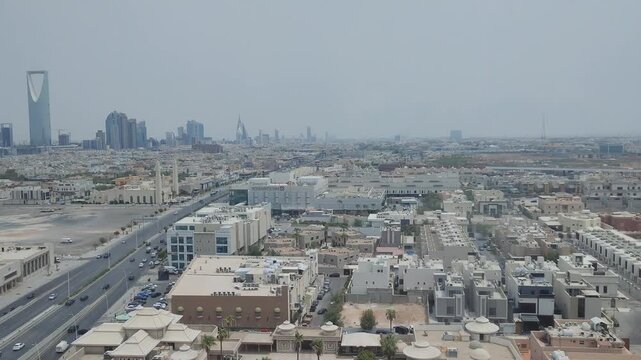 saudi arabia riyadh Aerial view of Riyadh skyline with Kingdom Centre and modern urban architecture under hazy sky in Saudi Arabia.