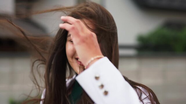 Close up of beautiful happy business woman with hair blowing in slow motion 120 fps