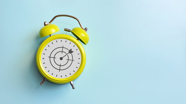 Alarm clock with target icon, time management and goal achievement concept