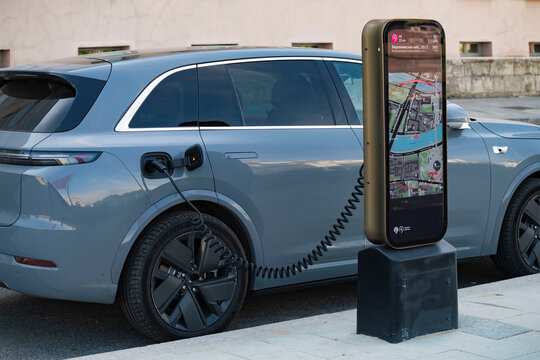 MOSCOW, RUSSIA - JULY 20, 2026: An electric car at the city charging station. Moscow